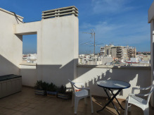 Tagterrasse - kig over tagene mod byen